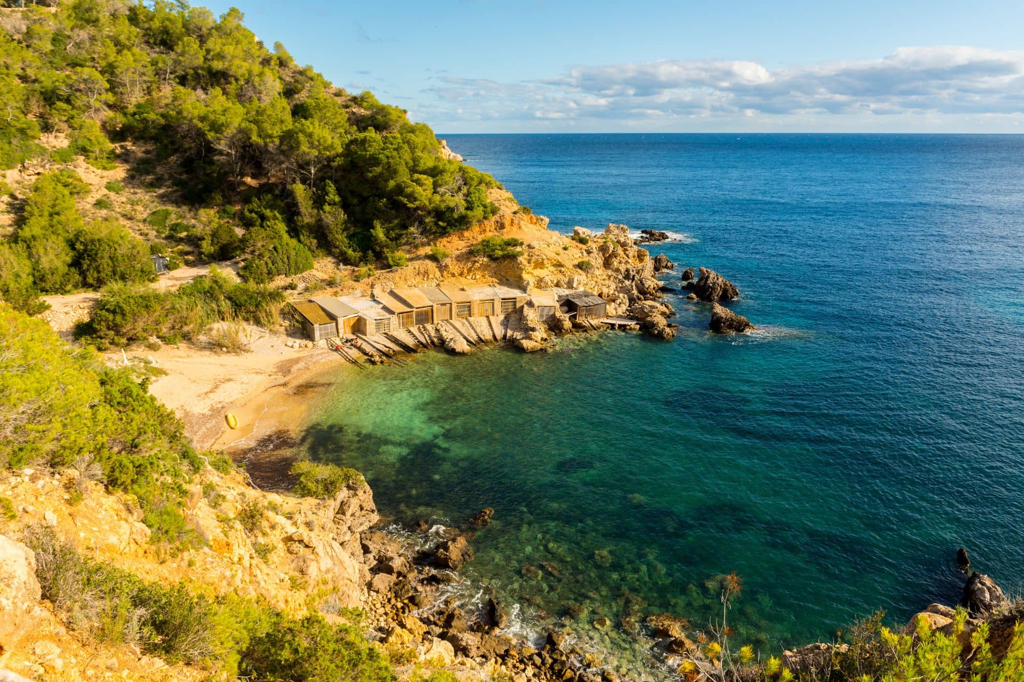 View of the bay Cala d'en Serra in Ibiza with turquoise water. 
