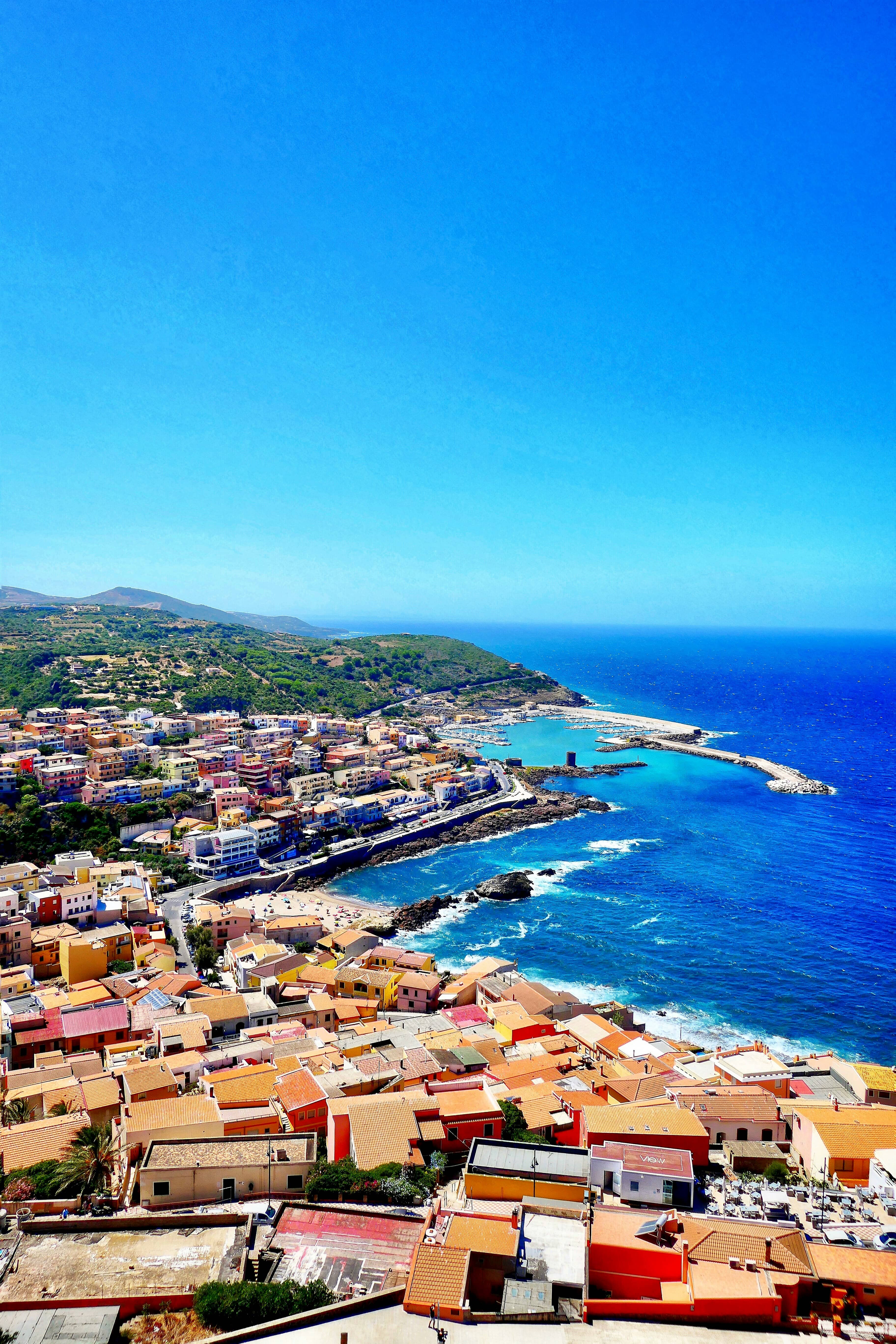 A coastal town with a port in Sardinia.