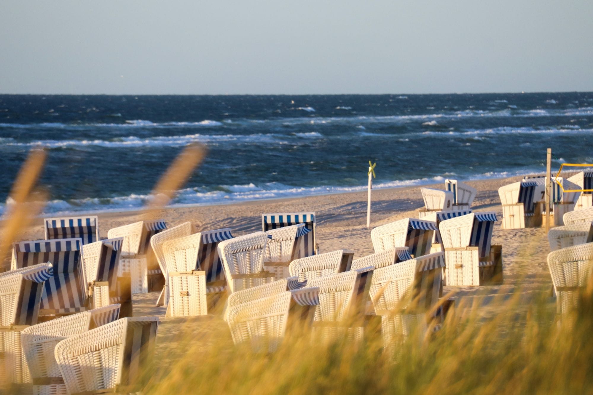 Several beach chairs by the ocean in Sylt.