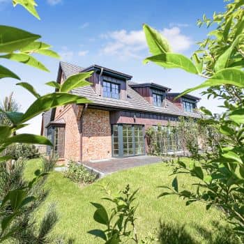 Modern frisian-styled house by the North Sea.