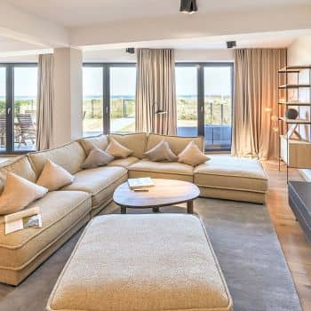 Modern living room of a penthouse by the Baltic Sea.