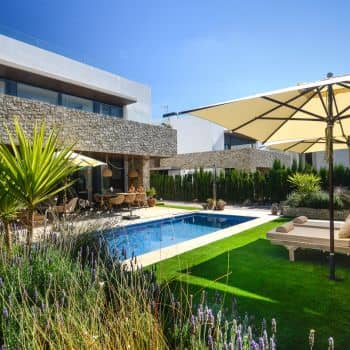 Modern villa with a garden and pool in Mallorca.